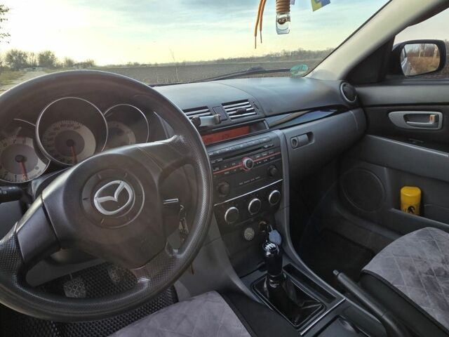 Серый Мазда 3, объемом двигателя 1.3 л и пробегом 197 тыс. км за 4600 $, фото 8 на Automoto.ua