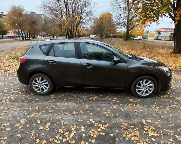 Серый Мазда 3, объемом двигателя 2 л и пробегом 195 тыс. км за 7200 $, фото 2 на Automoto.ua