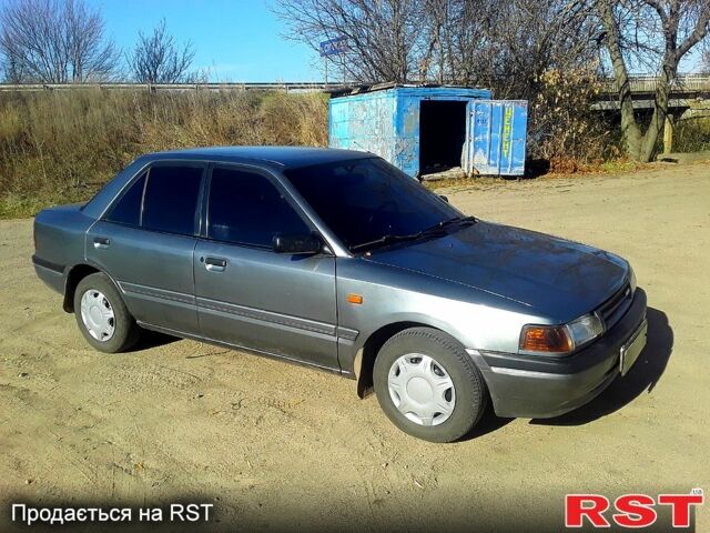 Серый Мазда 3, объемом двигателя 1.6 л и пробегом 205 тыс. км за 1500 $, фото 1 на Automoto.ua