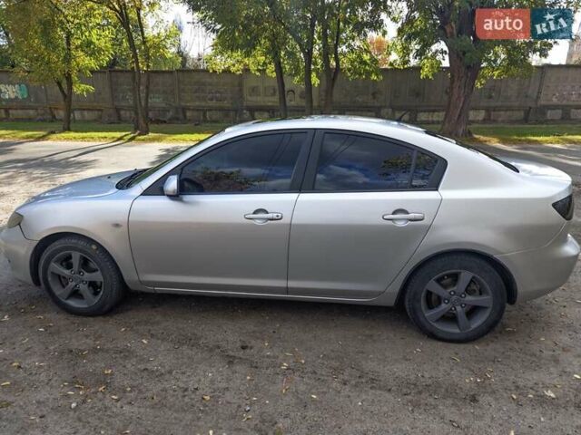 Серый Мазда 3, объемом двигателя 2 л и пробегом 250 тыс. км за 3600 $, фото 1 на Automoto.ua