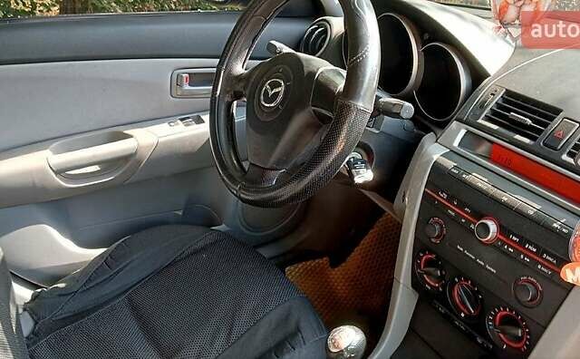 Серый Мазда 3, объемом двигателя 1.6 л и пробегом 350 тыс. км за 3400 $, фото 5 на Automoto.ua