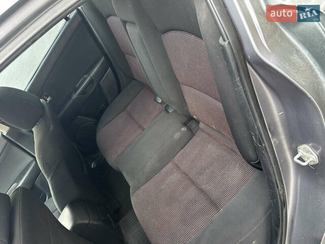 Серый Мазда 3, объемом двигателя 1.6 л и пробегом 180 тыс. км за 3000 $, фото 3 на Automoto.ua