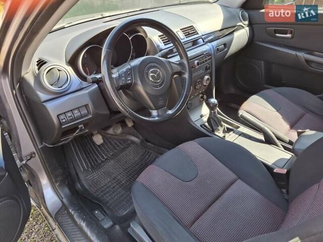 Серый Мазда 3, объемом двигателя 1.6 л и пробегом 175 тыс. км за 4600 $, фото 1 на Automoto.ua