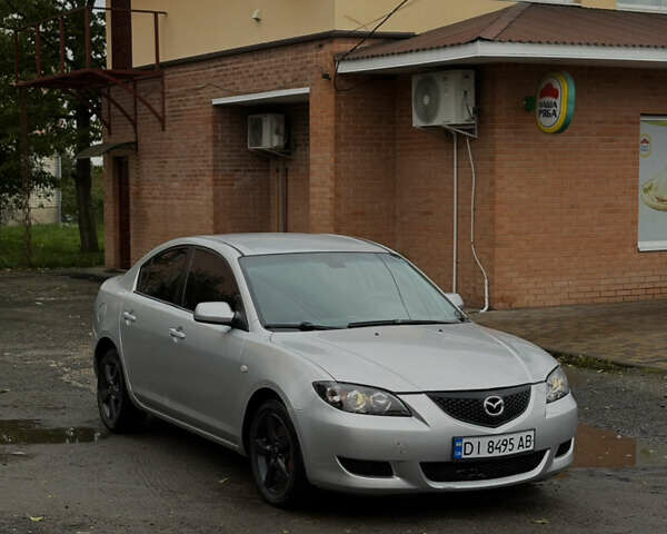 Серый Мазда 3, объемом двигателя 2 л и пробегом 229 тыс. км за 4000 $, фото 2 на Automoto.ua