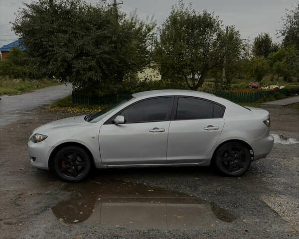 Серый Мазда 3, объемом двигателя 2 л и пробегом 229 тыс. км за 4000 $, фото 3 на Automoto.ua