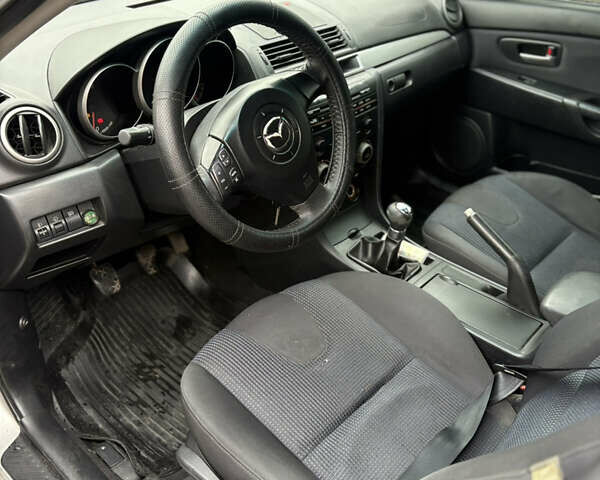 Серый Мазда 3, объемом двигателя 2 л и пробегом 229 тыс. км за 4000 $, фото 12 на Automoto.ua