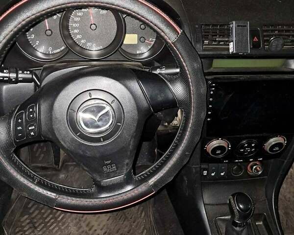 Серый Мазда 3, объемом двигателя 1.6 л и пробегом 320 тыс. км за 3000 $, фото 4 на Automoto.ua