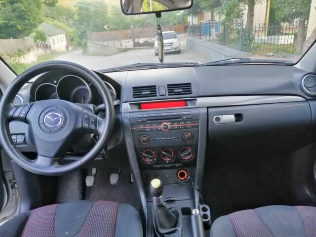Сірий Мазда 3, об'ємом двигуна 2.2 л та пробігом 180 тис. км за 2194 $, фото 5 на Automoto.ua