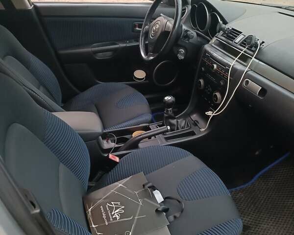 Серый Мазда 3, объемом двигателя 2 л и пробегом 300 тыс. км за 4500 $, фото 4 на Automoto.ua