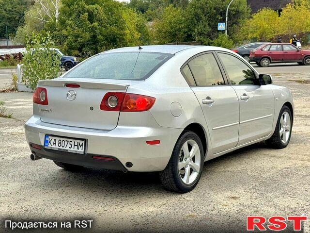 Сірий Мазда 3, об'ємом двигуна 2 л та пробігом 214 тис. км за 4450 $, фото 2 на Automoto.ua