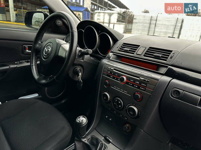 Серый Мазда 3, объемом двигателя 2 л и пробегом 188 тыс. км за 4999 $, фото 16 на Automoto.ua