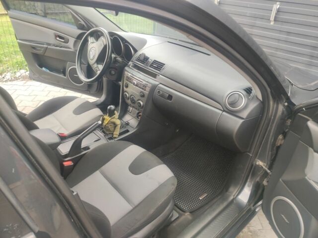 Сірий Мазда 3, об'ємом двигуна 2 л та пробігом 317 тис. км за 3100 $, фото 4 на Automoto.ua