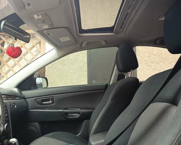 Серый Мазда 3, объемом двигателя 1.6 л и пробегом 196 тыс. км за 6000 $, фото 8 на Automoto.ua