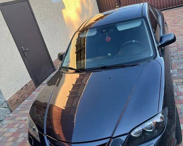 Серый Мазда 3, объемом двигателя 1.6 л и пробегом 196 тыс. км за 6000 $, фото 1 на Automoto.ua