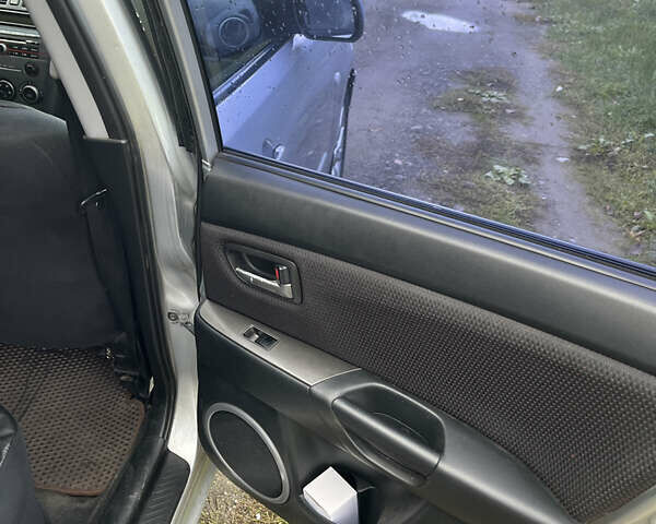 Серый Мазда 3, объемом двигателя 1.6 л и пробегом 305 тыс. км за 5500 $, фото 14 на Automoto.ua