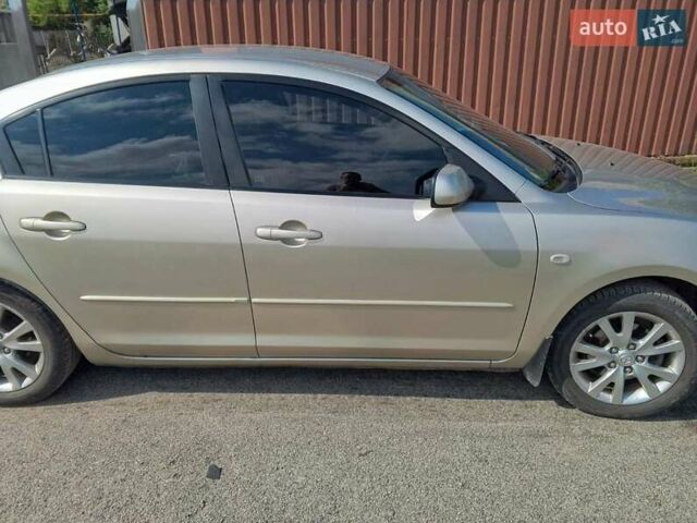 Серый Мазда 3, объемом двигателя 1.6 л и пробегом 186 тыс. км за 5000 $, фото 1 на Automoto.ua