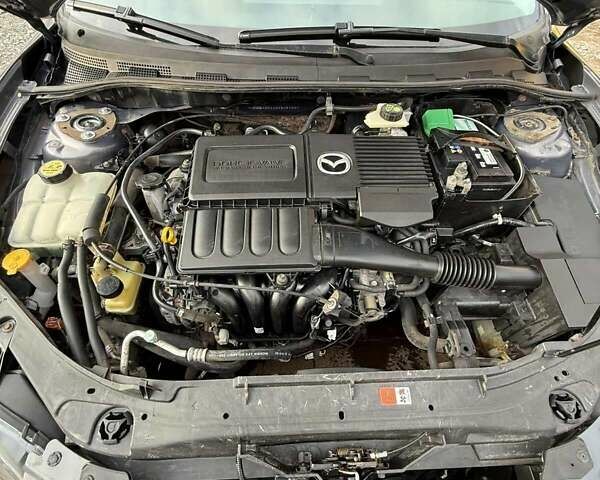 Серый Мазда 3, объемом двигателя 1.6 л и пробегом 230 тыс. км за 4000 $, фото 2 на Automoto.ua