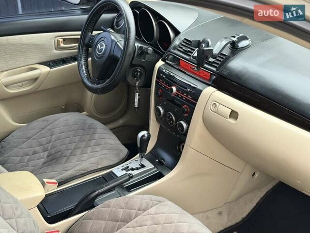 Серый Мазда 3, объемом двигателя 1.6 л и пробегом 170 тыс. км за 6000 $, фото 12 на Automoto.ua