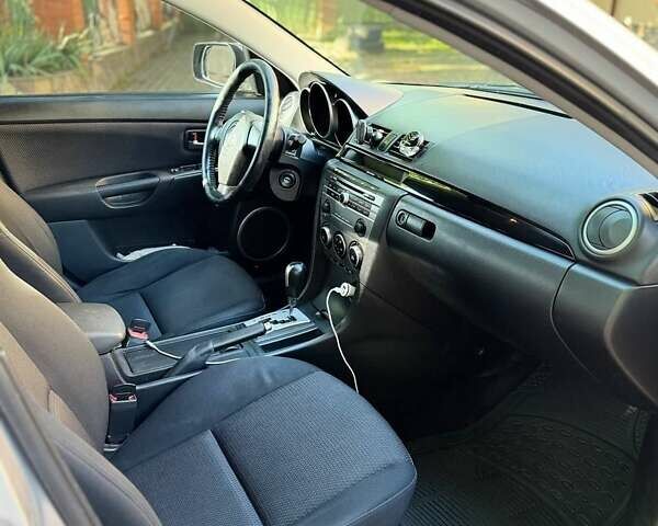 Серый Мазда 3, объемом двигателя 1.6 л и пробегом 270 тыс. км за 5950 $, фото 8 на Automoto.ua
