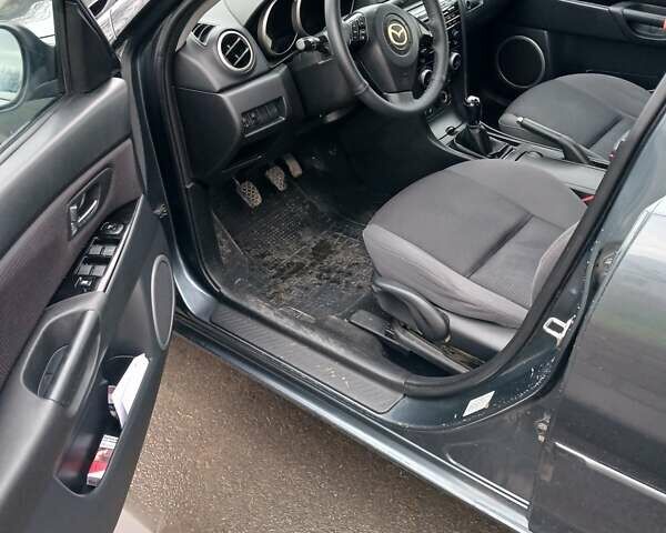 Серый Мазда 3, объемом двигателя 1.6 л и пробегом 223 тыс. км за 5600 $, фото 7 на Automoto.ua