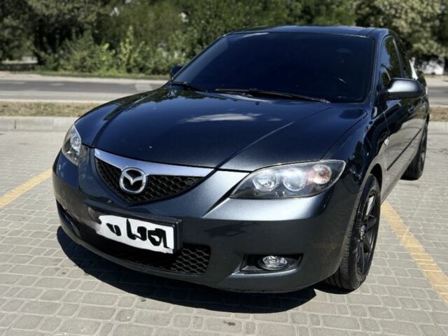 Серый Мазда 3, объемом двигателя 1.6 л и пробегом 140 тыс. км за 777 $, фото 1 на Automoto.ua