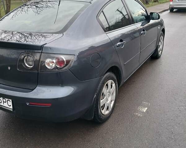Серый Мазда 3, объемом двигателя 1.6 л и пробегом 223 тыс. км за 5600 $, фото 2 на Automoto.ua