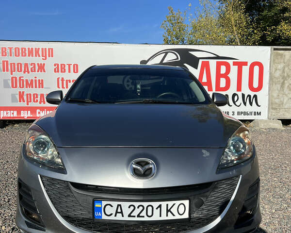 Сірий Мазда 3, об'ємом двигуна 2 л та пробігом 145 тис. км за 6200 $, фото 1 на Automoto.ua
