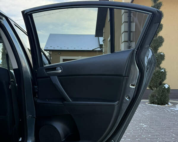 Сірий Мазда 3, об'ємом двигуна 2 л та пробігом 214 тис. км за 7250 $, фото 20 на Automoto.ua