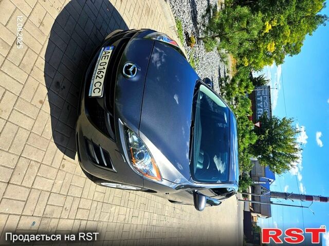 Серый Мазда 3, объемом двигателя 1.6 л и пробегом 118 тыс. км за 9900 $, фото 1 на Automoto.ua