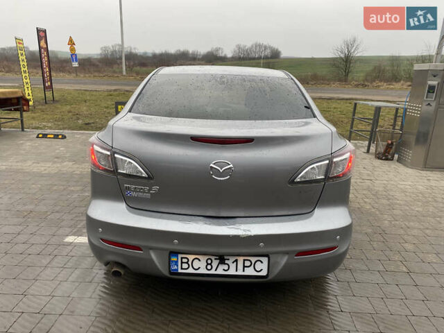 Серый Мазда 3, объемом двигателя 2 л и пробегом 200 тыс. км за 6999 $, фото 3 на Automoto.ua