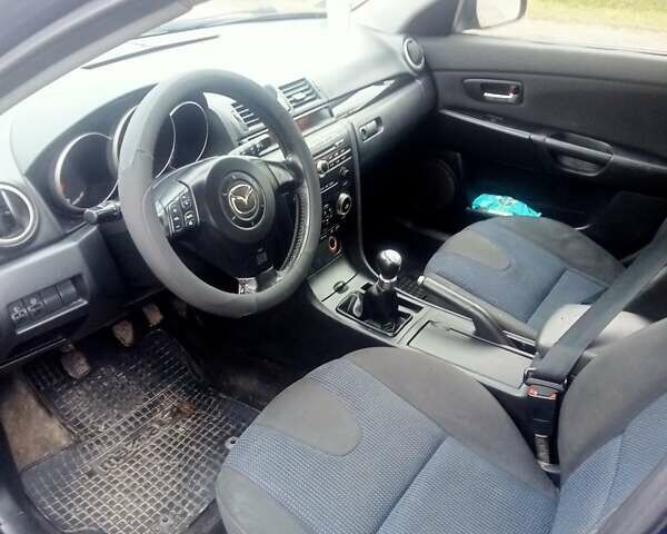 Синій Мазда 3, об'ємом двигуна 1.35 л та пробігом 260 тис. км за 2500 $, фото 4 на Automoto.ua