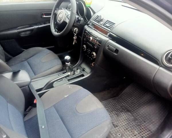 Синій Мазда 3, об'ємом двигуна 1.35 л та пробігом 260 тис. км за 2500 $, фото 8 на Automoto.ua