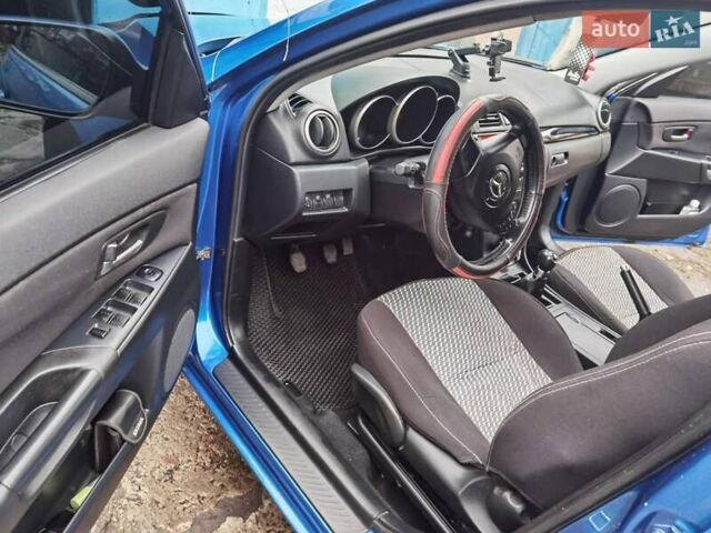 Синий Мазда 3, объемом двигателя 1.56 л и пробегом 253 тыс. км за 4200 $, фото 1 на Automoto.ua