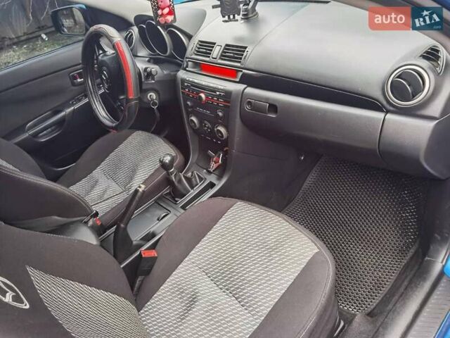 Синий Мазда 3, объемом двигателя 1.56 л и пробегом 253 тыс. км за 4200 $, фото 6 на Automoto.ua