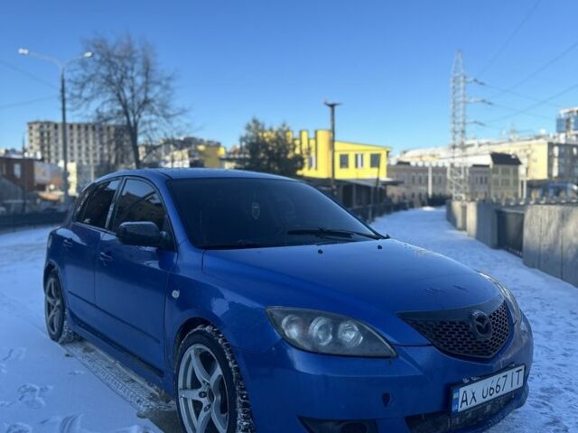 Синий Мазда 3, объемом двигателя 2 л и пробегом 225 тыс. км за 1999 $, фото 1 на Automoto.ua