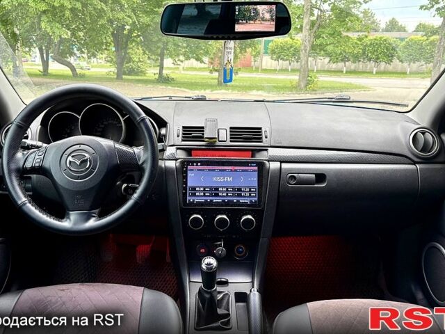 Синій Мазда 3, об'ємом двигуна 1.3 л та пробігом 243 тис. км за 3300 $, фото 6 на Automoto.ua