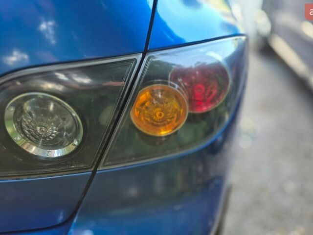 Синій Мазда 3, об'ємом двигуна 1.6 л та пробігом 300 тис. км за 4041 $, фото 6 на Automoto.ua