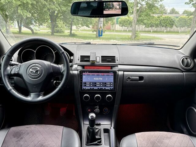 Синий Мазда 3, объемом двигателя 1.3 л и пробегом 243 тыс. км за 3300 $, фото 6 на Automoto.ua