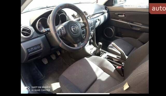 Синий Мазда 3, объемом двигателя 1.6 л и пробегом 172 тыс. км за 5800 $, фото 9 на Automoto.ua