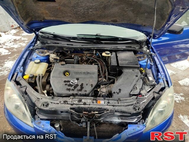 Синий Мазда 3, объемом двигателя 2 л и пробегом 230 тыс. км за 4500 $, фото 2 на Automoto.ua