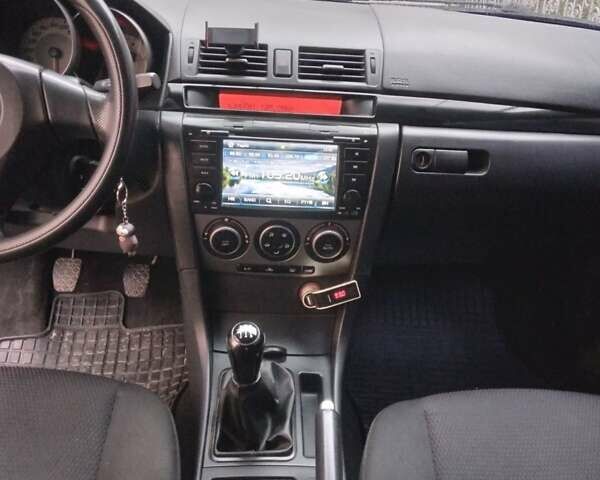 Синий Мазда 3, объемом двигателя 1.6 л и пробегом 107 тыс. км за 4500 $, фото 4 на Automoto.ua
