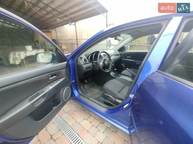 Синий Мазда 3, объемом двигателя 1.6 л и пробегом 244 тыс. км за 5676 $, фото 1 на Automoto.ua