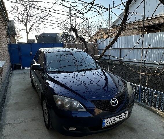 Синий Мазда 3, объемом двигателя 1.6 л и пробегом 245 тыс. км за 4300 $, фото 1 на Automoto.ua