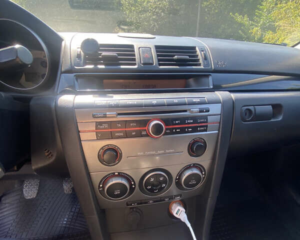 Синій Мазда 3, об'ємом двигуна 1.56 л та пробігом 321 тис. км за 4299 $, фото 12 на Automoto.ua