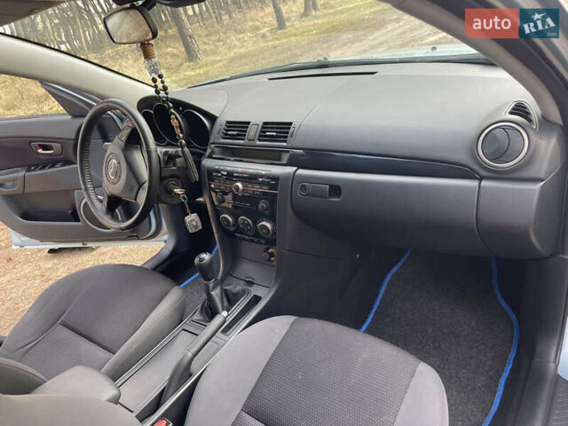 Синий Мазда 3, объемом двигателя 1.6 л и пробегом 227 тыс. км за 5400 $, фото 46 на Automoto.ua