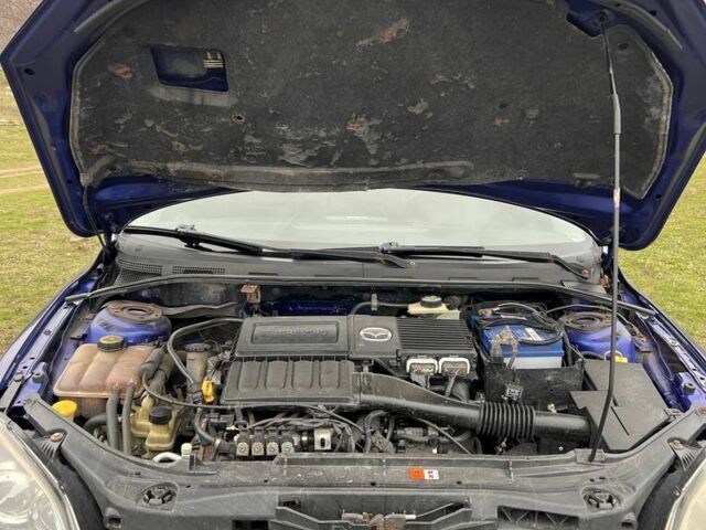 Синий Мазда 3, объемом двигателя 1.6 л и пробегом 357 тыс. км за 4499 $, фото 4 на Automoto.ua