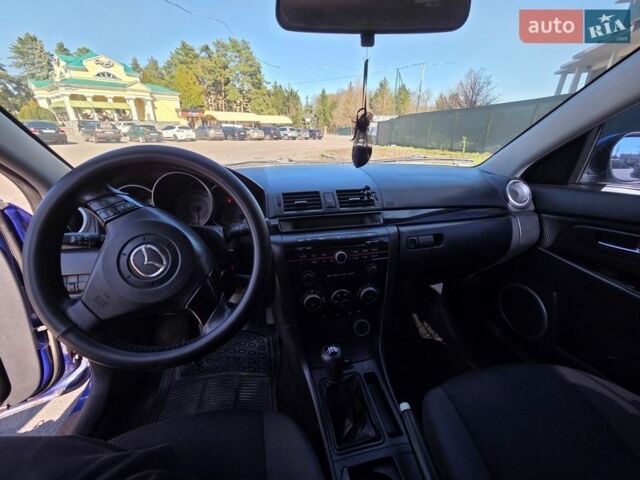 Синий Мазда 3, объемом двигателя 1.35 л и пробегом 235 тыс. км за 4950 $, фото 4 на Automoto.ua