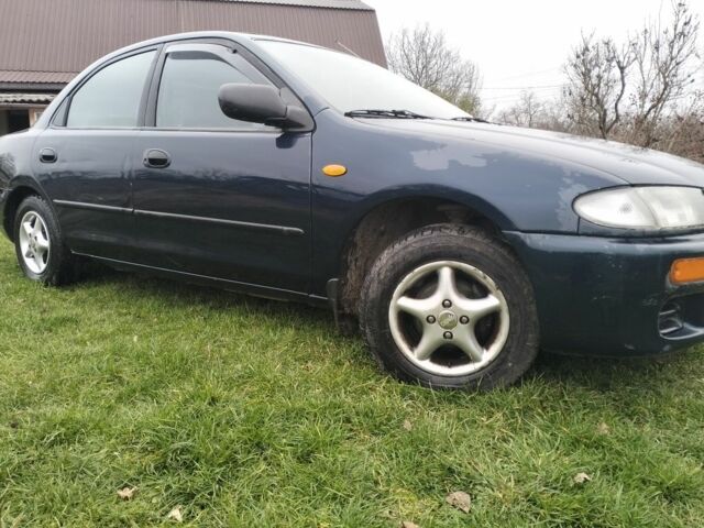 Синий Мазда 3, объемом двигателя 1.5 л и пробегом 260 тыс. км за 1300 $, фото 2 на Automoto.ua