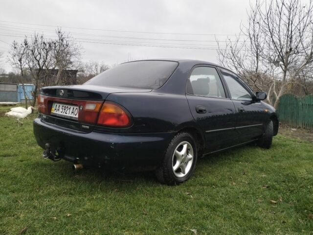 Синий Мазда 3, объемом двигателя 1.5 л и пробегом 260 тыс. км за 1300 $, фото 1 на Automoto.ua