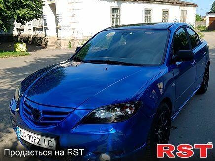 Синий Мазда 3, объемом двигателя 2 л и пробегом 330 тыс. км за 4200 $, фото 4 на Automoto.ua